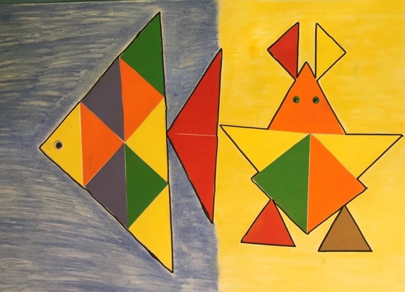 Kompozycja z kolorowych trójkątów na płaszczyźnie – ryba i krab